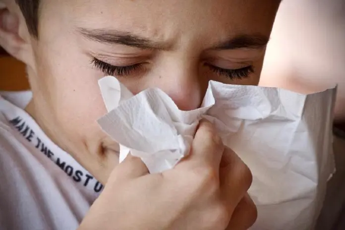 HRHQ Illness in the Workplace worker suffering from cold symptoms