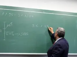 teacher at blackboard