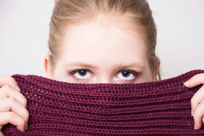 HRHQ Reporting Company Grievances Woman hiding identity behind scarf