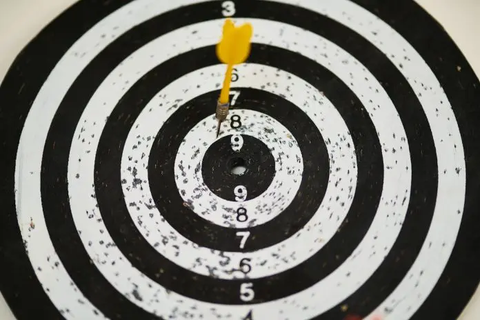pexels-engin-akyurt-1552617 black and white dartboard with dart missing bullseye