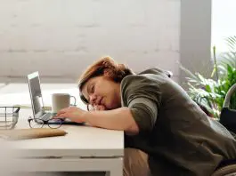 woman sleeping at her desk