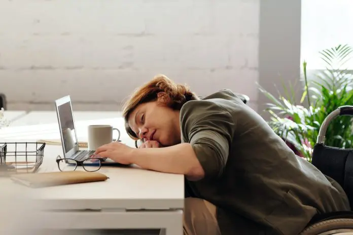 woman sleeping at her desk