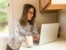 Woman remote working in kitchen