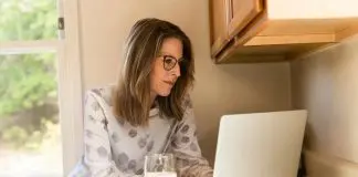 Woman remote working in kitchen
