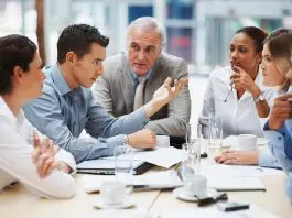 group of managers meeting in office