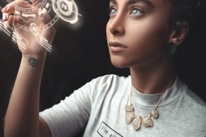 pexels-ali-pazani-2777898 lady interacting with hologram solar system image