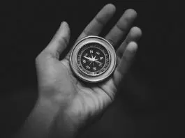 compass in palm of hand