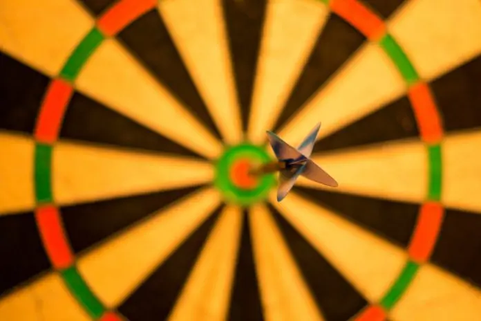 picture of dart in bullseye against blurred out dartboard