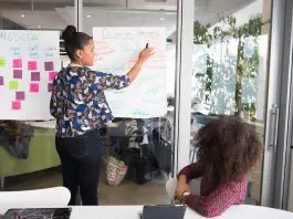 training session, lady pointing at information