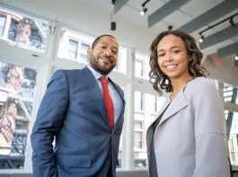 man and woman in office