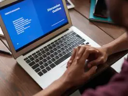 person doing online course on laptop