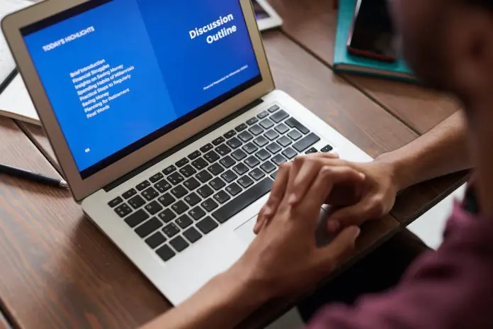 person doing online course on laptop