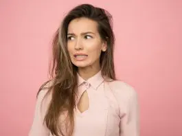 woman in office attire looking concerned