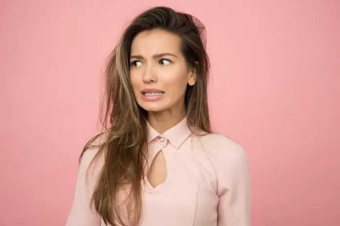 pexels-moose-photos-1036620 woman in office attire looking concerned