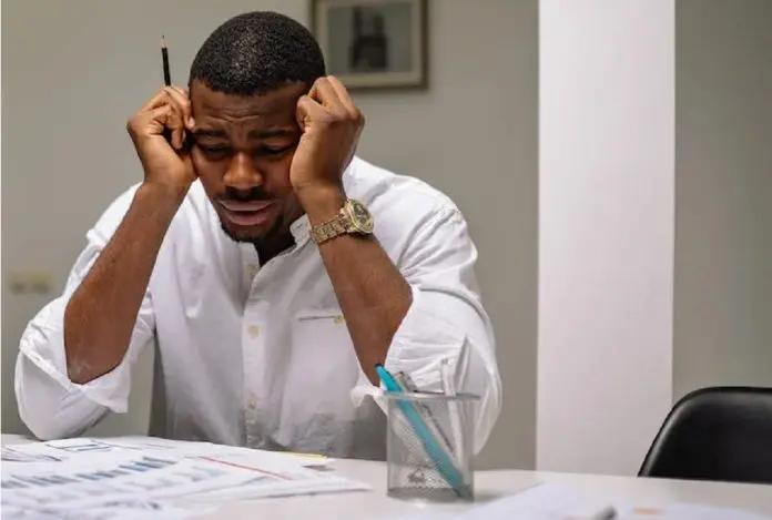 HRHQ January Blues depressed man at workstation