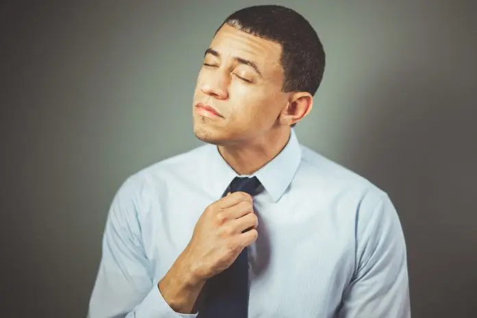 pexels-craig-adderley-1605226 (1) frustrated man tugging at tie