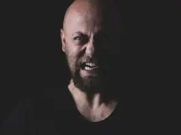 angry bald man with beard