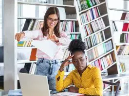 2 women in a n office looking concerned
