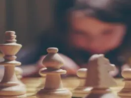pieces of chess on chessboard
