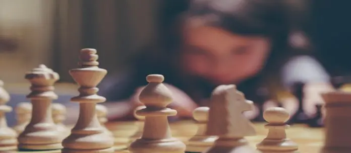 michal-parzuchowski-5U7i1R8V9yA-unsplash pieces of chess on chessboard
