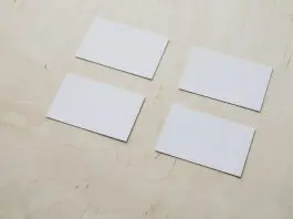 4 plain white cards on table