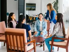 employees at wellbeing meeting