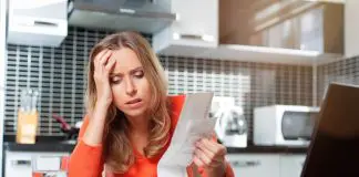Stressed,Young,Woman,Is,Doing,Banking,And,Administrative,Work,Holding