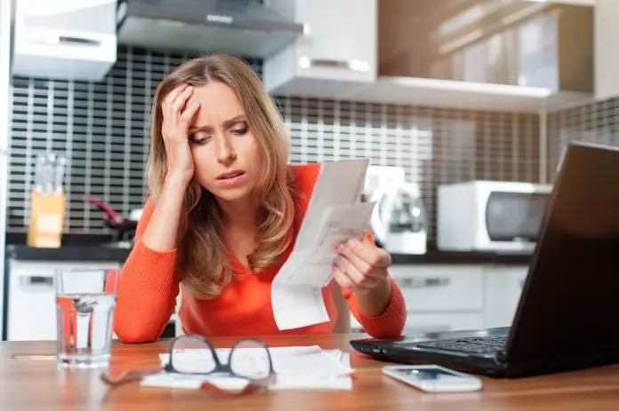 HRHQ Financial wellbeing Stressed,Young,Woman,Is,Doing,Banking,And,Administrative,Work,Holding