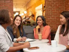group of woment sitting around a table chatting