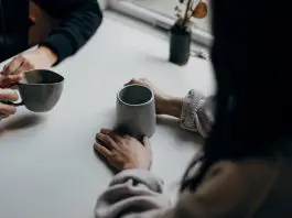 2 people chatting over coffee