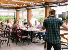 man speaking to a group of people