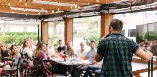 man speaking to a group of people