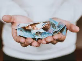 Man holding a lot of money