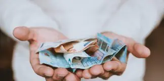Man holding a lot of money