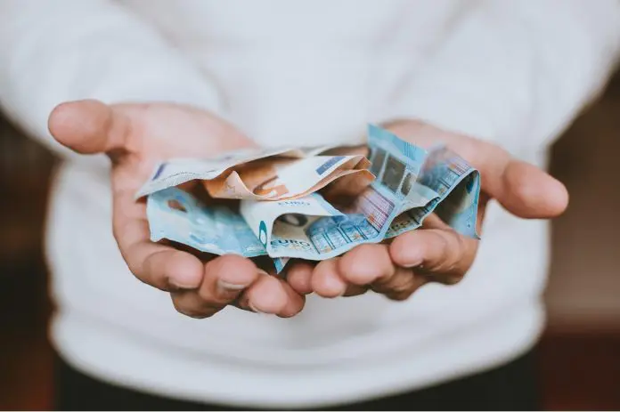 Man holding a lot of money