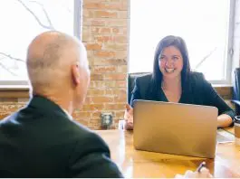 leader and team member in meeting