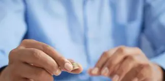 Man counting euro coins.