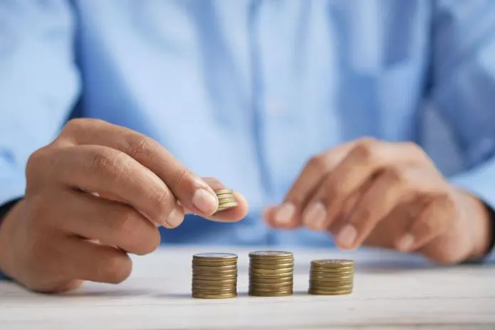 HRHQ Auto Enrolment Man counting euro coins.