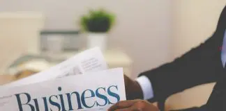 Businessman reading newspaper
