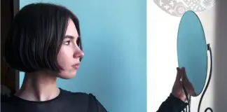 woman looking into mirrorr