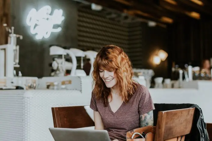 brooke-cagle-WHWYBmtn3_0-unsplash happy woman on video conference call