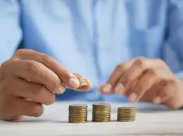 person stacking coins