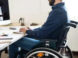 Disabled worker at work station