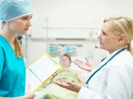 Irish doctor in discussion with nurse