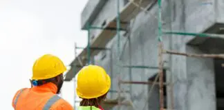 Construction workers viewing site