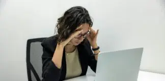 Stressed HR professional sitting at desk