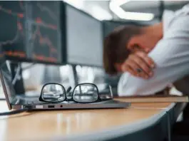 Worker at desk suffering burnout