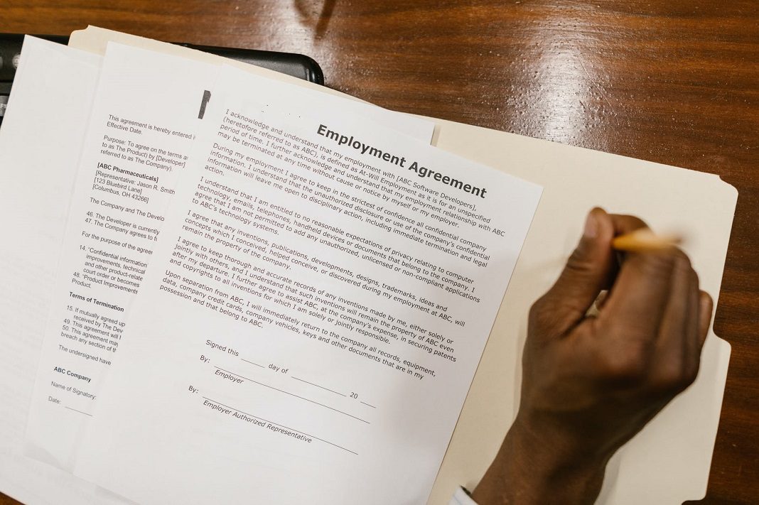 person reading employment agreement