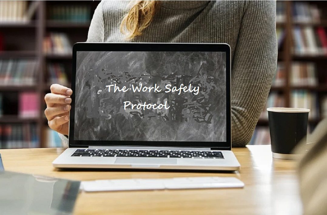 Woman holding laptop screen