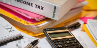 calculator and income tax book for payroll